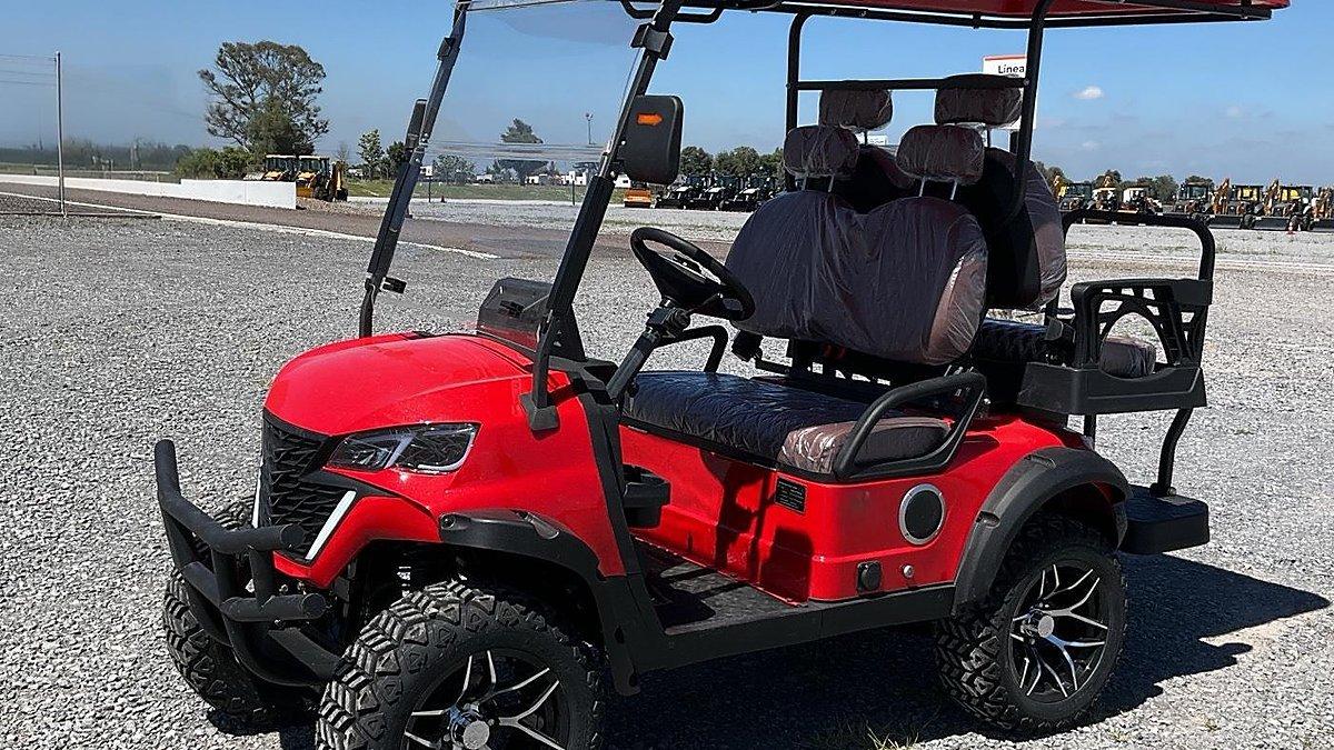 Red golf cart at the Cranbrook auction